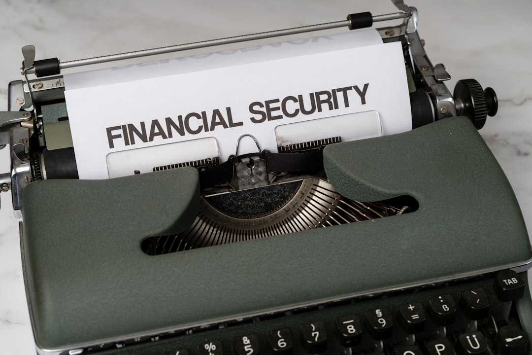 hero-img a-close-up-of-a-typewriter-with-a-financial-security-sign-on-it-jxaxmusuwsq
